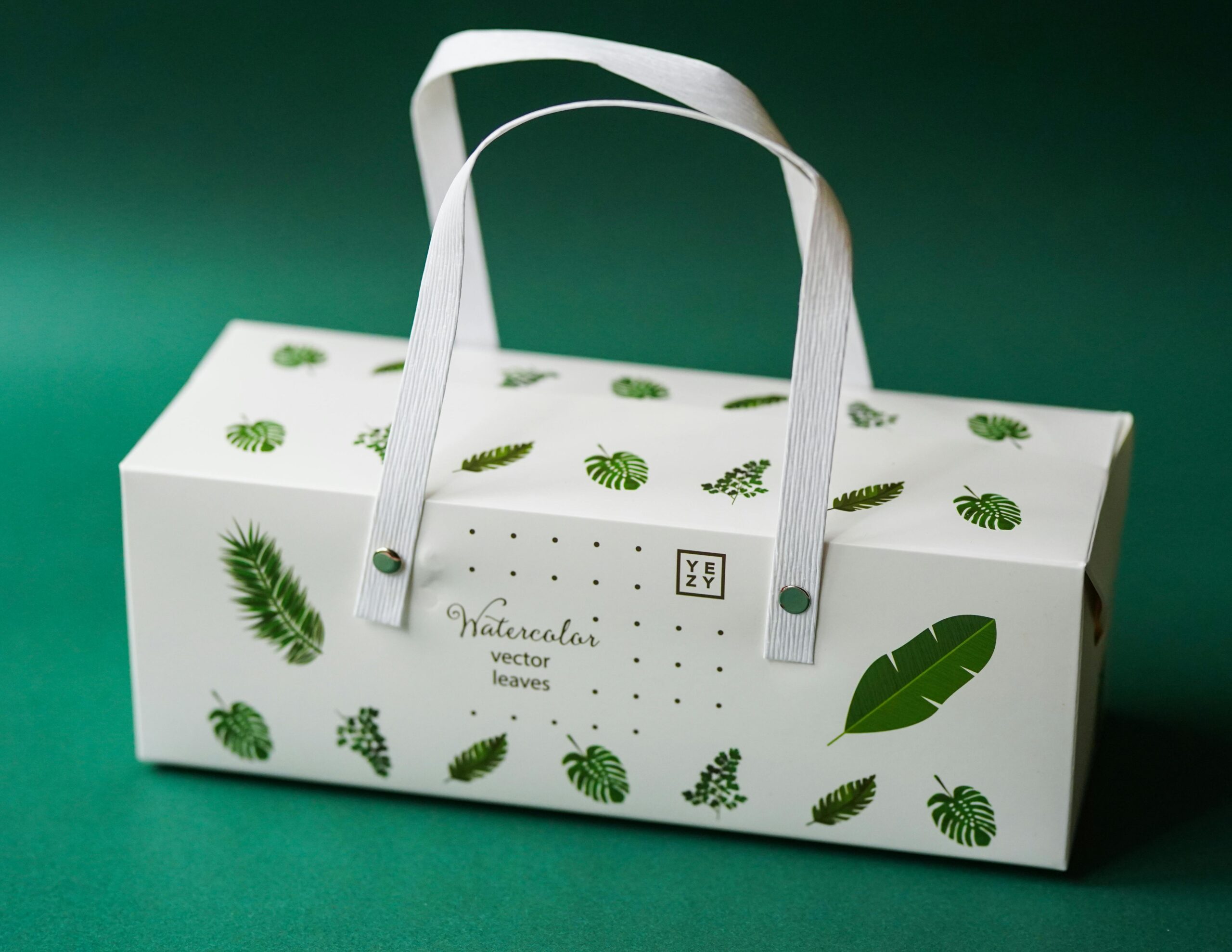 Eco - friendly packaging box with green leaf designs: symbolizes low - waste retail models. Aligns with icanteen’s bulk/unpackaged food recognition, encouraging sustainable food service. Supports esg goals by reducing packaging waste.