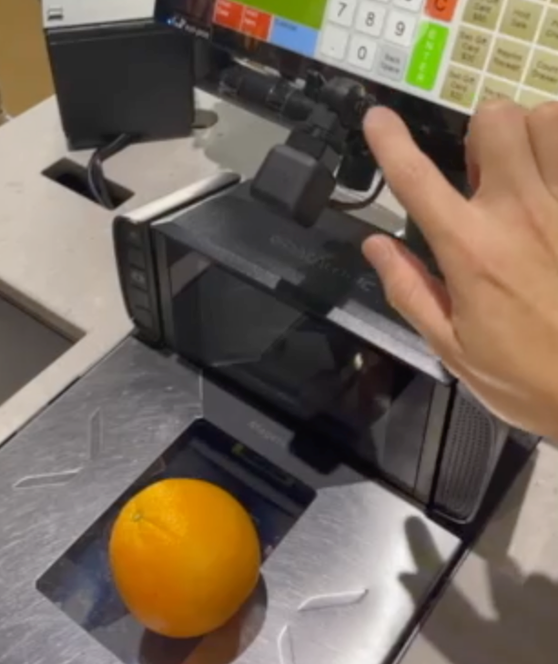 Ai Weighing System In Action, A Smart Scale Automatically Identifies And Weighs An Orange Using Advanced Computer Vision Technology Ai weighing system in action, a smart scale automatically identifies and weighs an orange using advanced computer vision technology