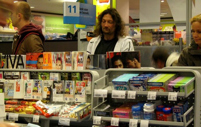 Customers at a retail store checkout needing an ai cashier loss prevention.