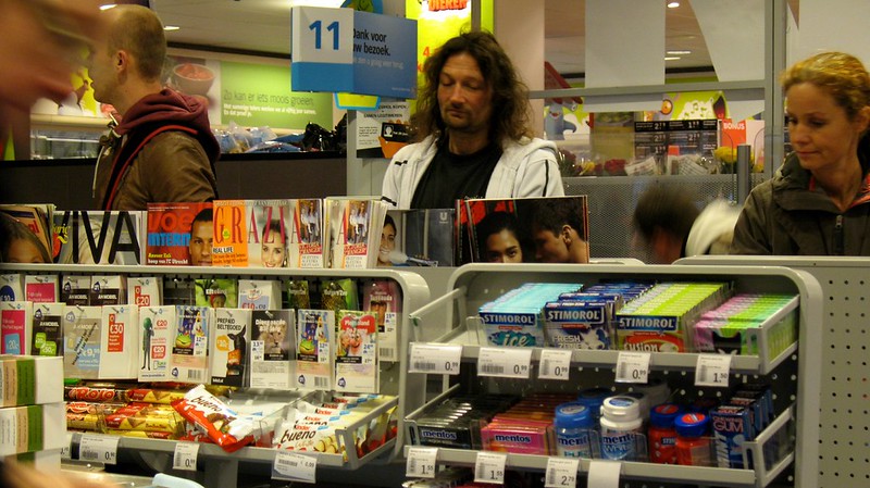 Customers at a retail store checkout needing an ai cashier loss prevention.