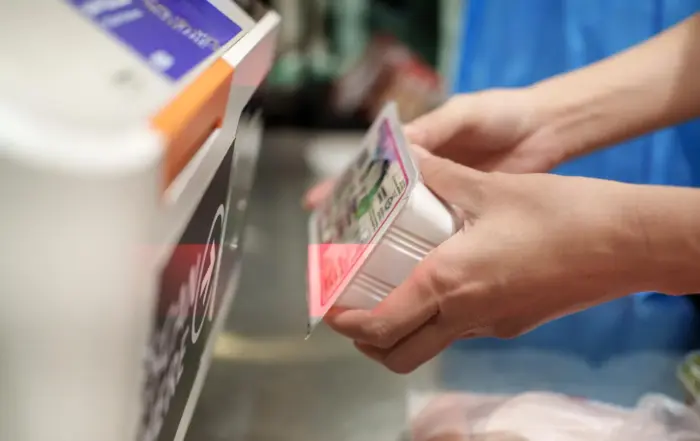 Ai loss prevention use cases, camera detecting missed scans at a retail self-checkout kiosk